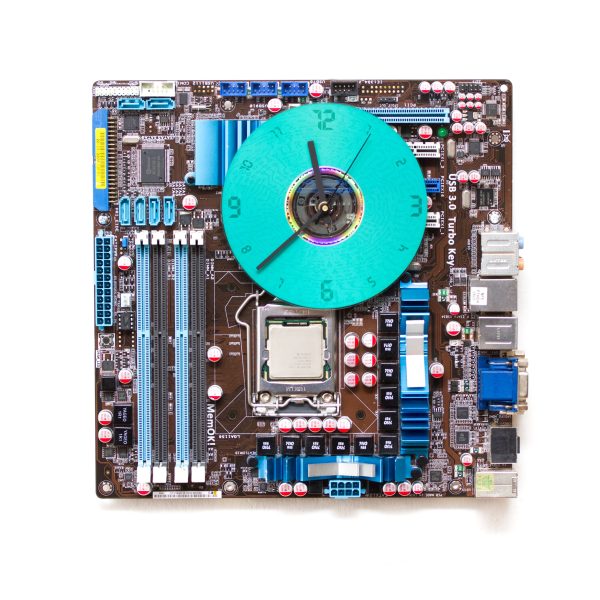 Geeky Wall Clock made of a black   dark brown circuit board with a blue clock face Online Sale